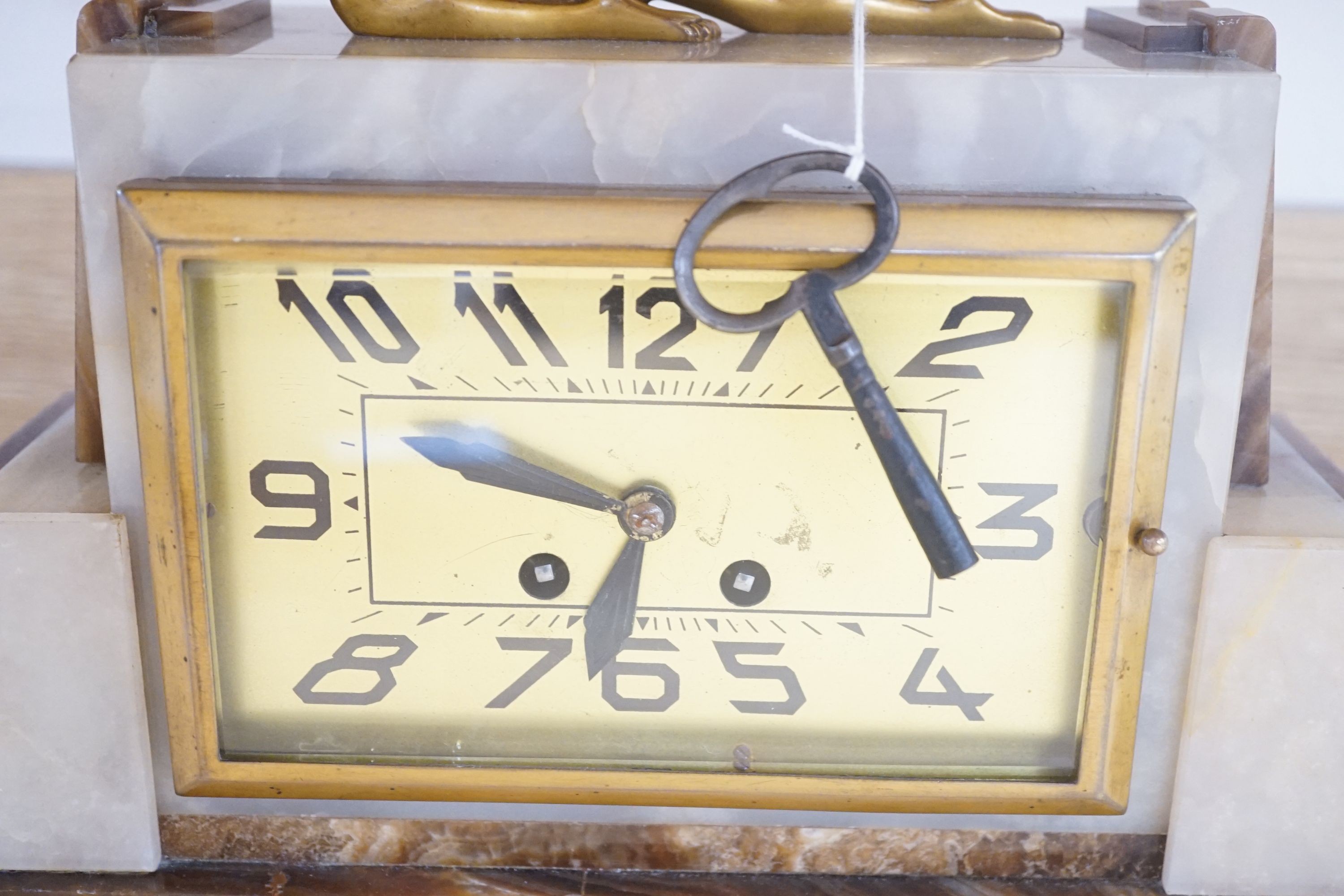 An Art Deco marble and bronze figural clock 52cm